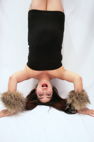 Our model is wearing the High-End Fur Cuffs in Raccoon.