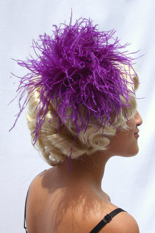 Our model is wearing the Ostrich Feather Hairclip in Purple.