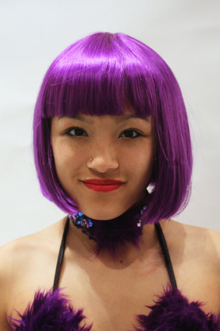 Our model is wearing the Babydoll wig in Purple.