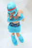 Our model is wearing the Fur Leg Warmers in Turquoise.