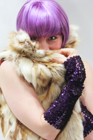 Our model is wearing the Long Sequins Cuff in Purple.