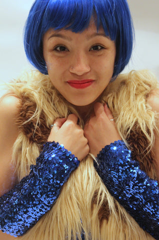 Our model is wearing the medium sequins cuffs in Royal Blue.