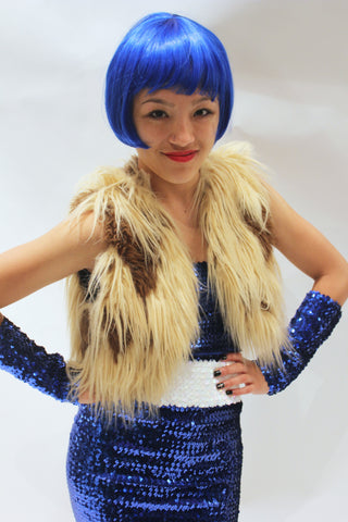 Our model is wearing the High-End Fur Bolero Vest in Camel Long.