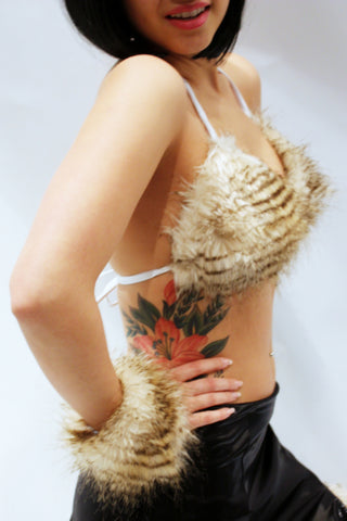 Our model is wearing the high-end fur bikini top in Blonde Raccoon.