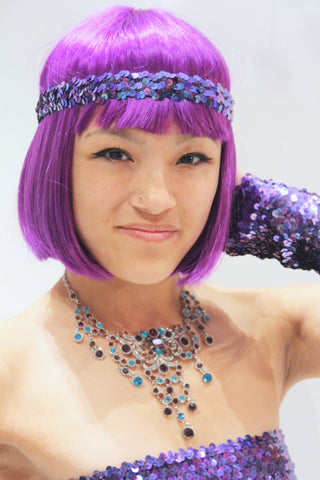 Our model is wearing the Sequins Headband in Purple AB.