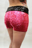 Our model is wearing the long sequins hot pant in Neon Pink with a black sequins belt.