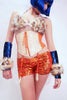 Our model is wearing the Short Sequins Hot Pant in Neon Orange.