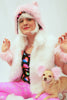 Our model is wearing the Faux Fur Kitty Hat in Light Pink.