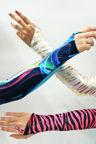 Our models are wearing the Gauntlet Gloves in Gold Zebra, Blue Swirl and Velvet Pink Zebra.